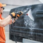 Men Washing Back of His Truck Cabin